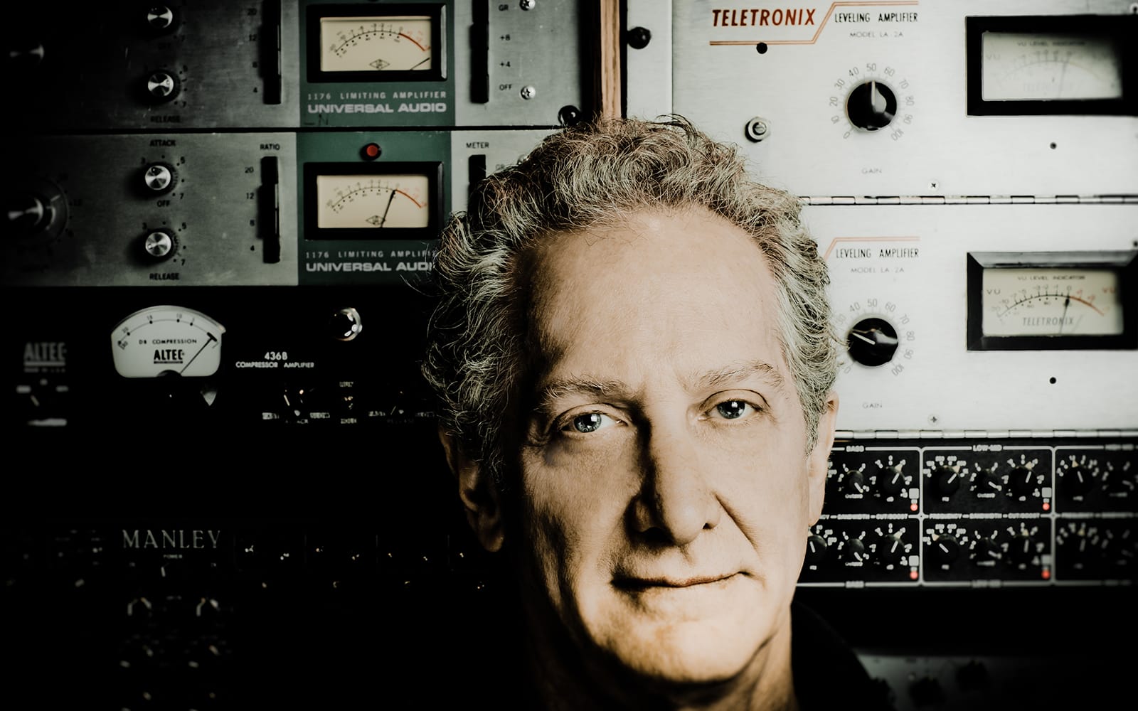 Michael Brauer surrounded by studio equipment